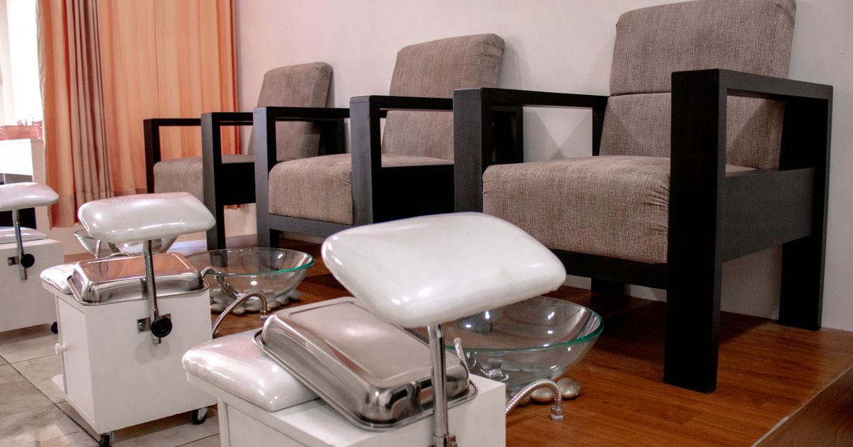 A row of pedicure chairs and foot baths, ready for a full weekend