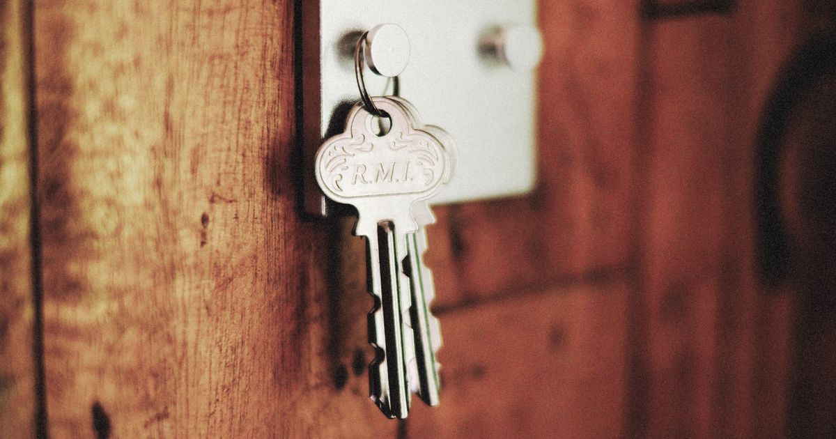 A set of keys on a hook by the door, for the renter who locks up
