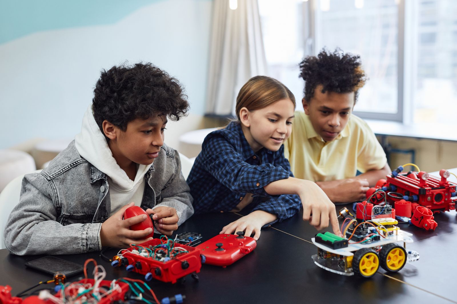 Kids building robots together after school