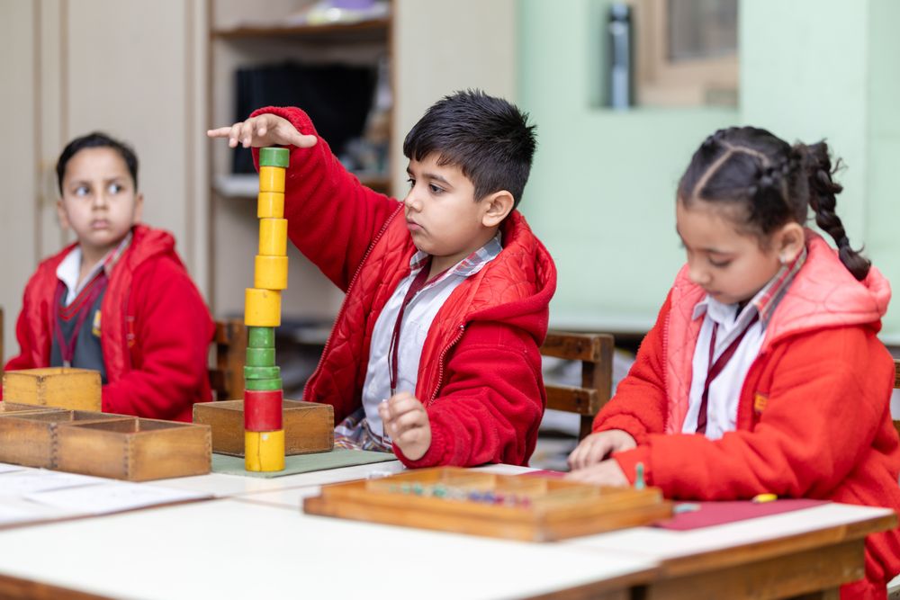 Children building with wooden blocks
