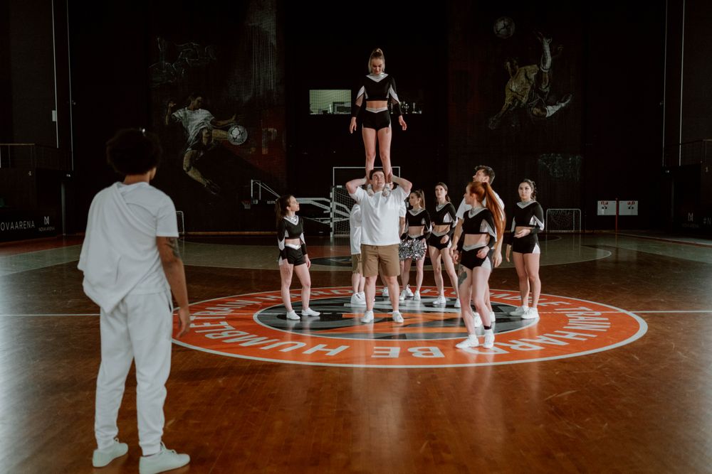A stunt group mid-lift at practice
