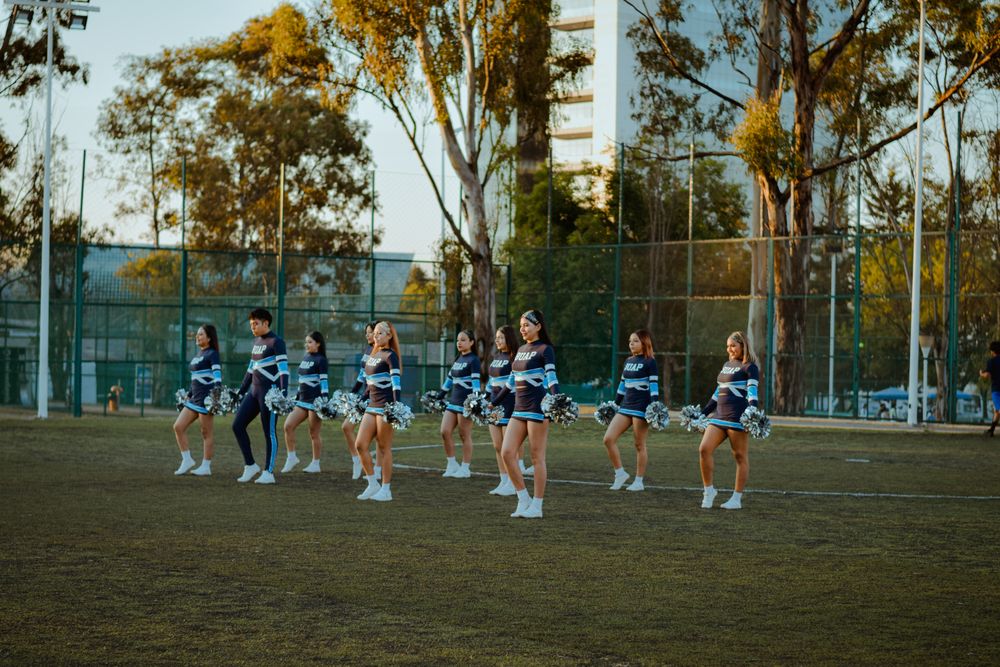 A squad running its routine on an outdoor field